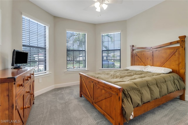 bedroom featuring light carpet and ceiling fan