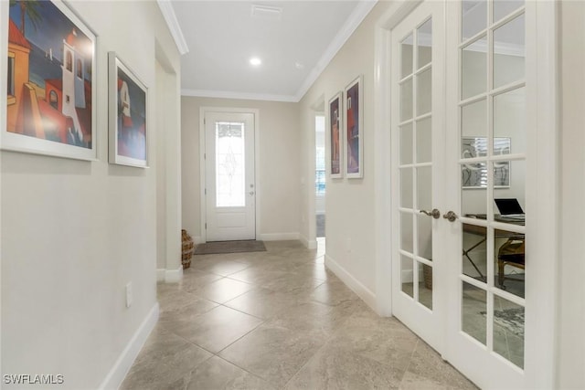 foyer with ornamental molding and french doors