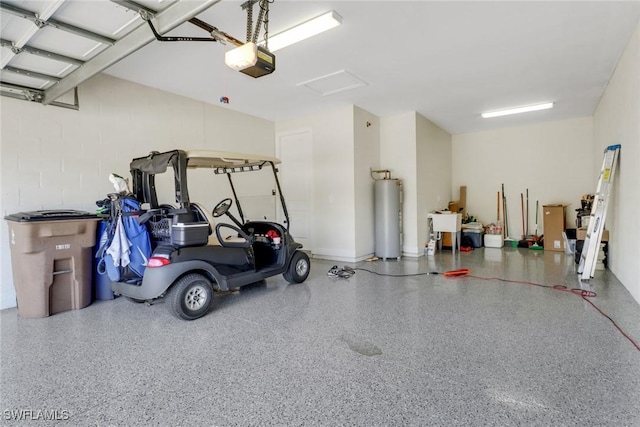 garage with a garage door opener and water heater