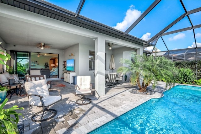 pool featuring a patio area, a ceiling fan, and area for grilling