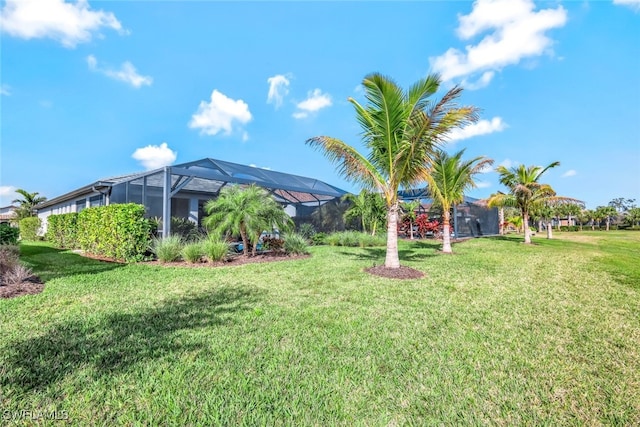 view of yard featuring glass enclosure