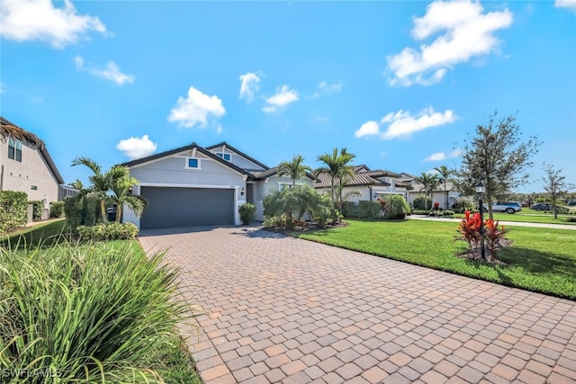 single story home featuring decorative driveway, stucco siding, a garage, a residential view, and a front lawn