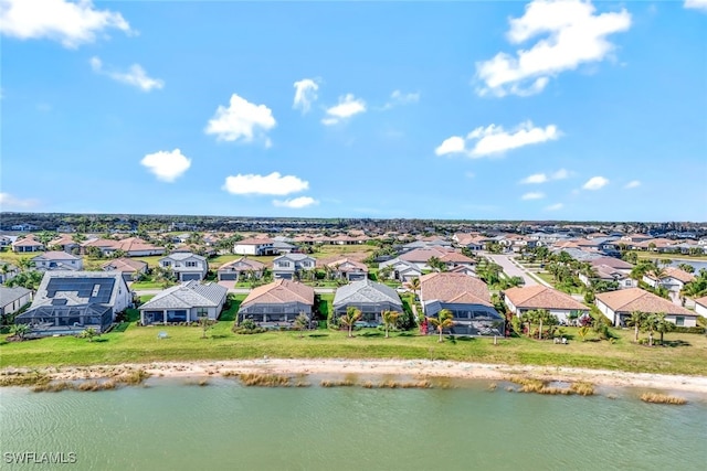 aerial view with a residential view and a water view