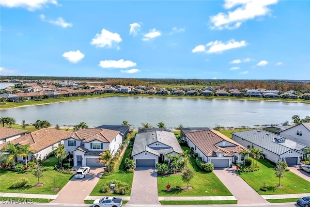 aerial view with a residential view and a water view