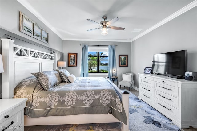 bedroom featuring ceiling fan and ornamental molding