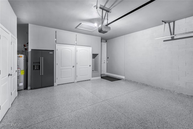 garage with water heater, high end black refrigerator, concrete block wall, and a garage door opener