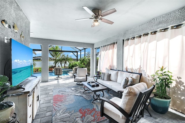 19585 Deming Ln, Estero, FL 33928 - interior space featuring glass enclosure, a ceiling fan, an in ground hot tub, an outdoor pool, and an outdoor hangout area