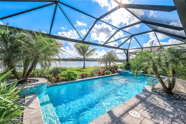 view of swimming pool with a water view, a pool with connected hot tub, a lanai, and a patio