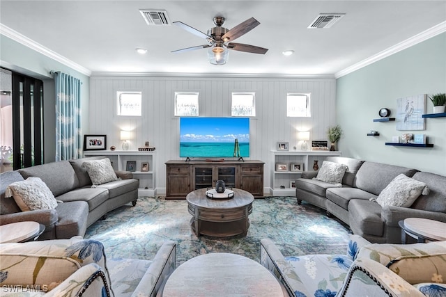 living room with ceiling fan, visible vents, and ornamental molding