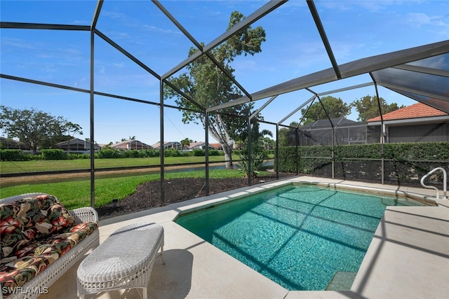 pool with a patio area and a lanai