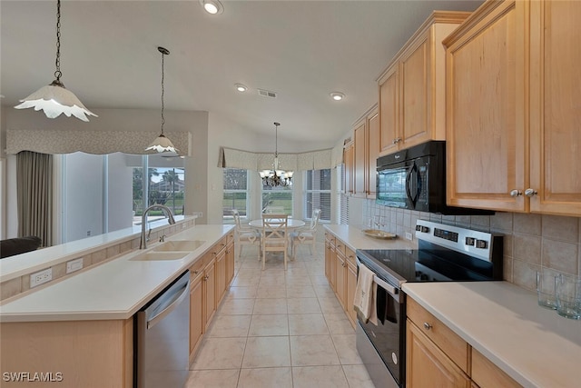 kitchen with light brown cabinetry, decorative backsplash, an inviting chandelier, stainless steel appliances, and a sink