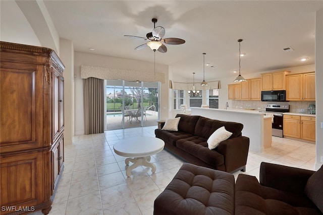 tiled living room with ceiling fan