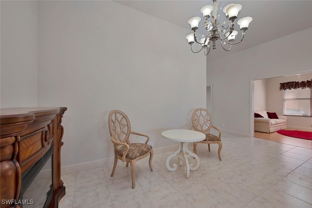 sitting room featuring a chandelier