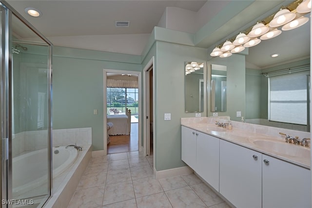 bathroom featuring lofted ceiling, plus walk in shower, tile patterned flooring, and vanity