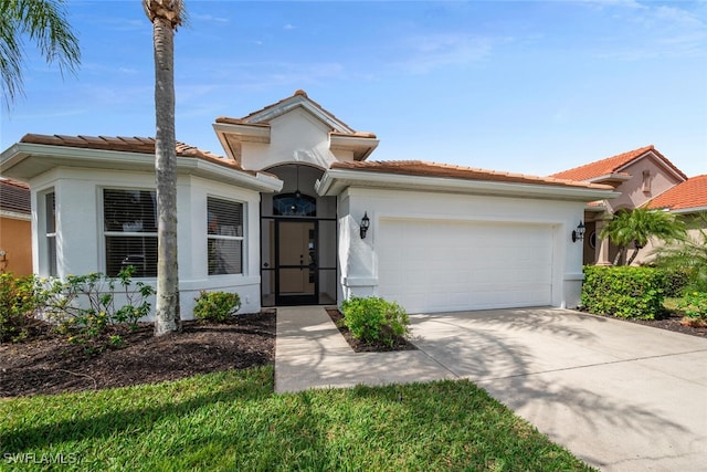 mediterranean / spanish house featuring stucco siding, driveway, an attached garage, and a tile roof