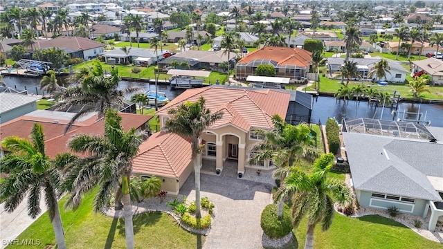 aerial view with a water view and a residential view