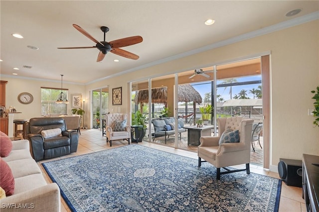 living room with crown molding, recessed lighting, plenty of natural light, and light tile patterned floors