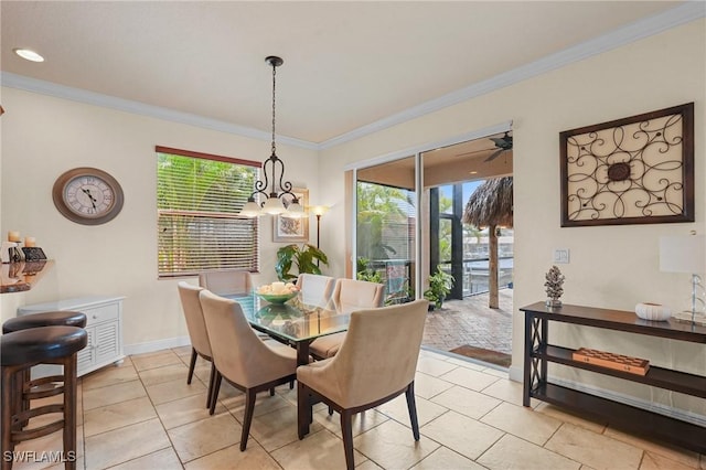 dining space with light tile patterned floors, ornamental molding, and baseboards