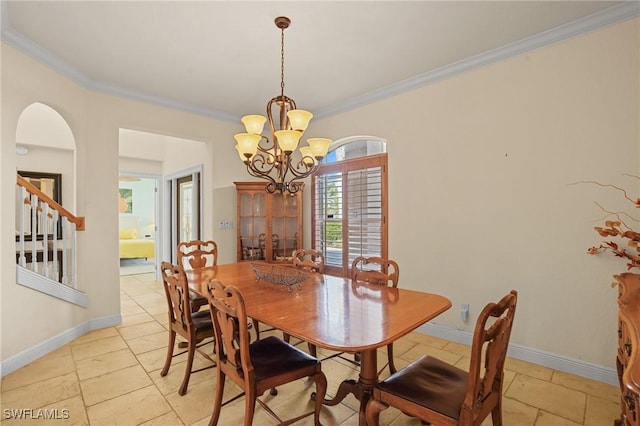 dining space featuring arched walkways, baseboards, ornamental molding, stairway, and an inviting chandelier