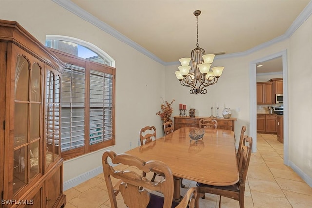 dining area featuring a chandelier, light tile patterned floors, baseboards, and crown molding