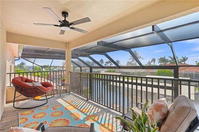 sunroom with a wealth of natural light and ceiling fan