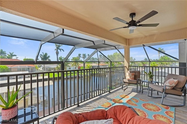 exterior space featuring a water view and a ceiling fan