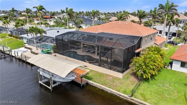 birds eye view of property with a water view and a residential view