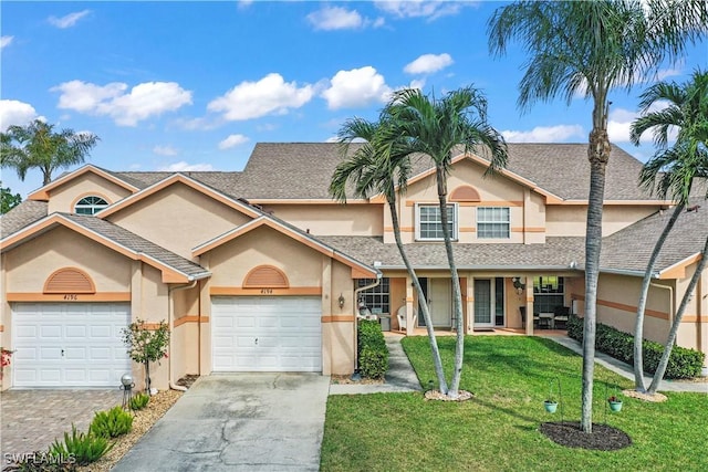 front of property featuring a garage and a front lawn