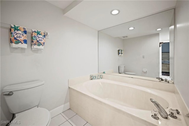 bathroom featuring a bath, tile patterned floors, and toilet