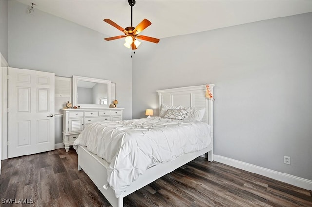 bedroom with high vaulted ceiling, dark hardwood / wood-style floors, and ceiling fan