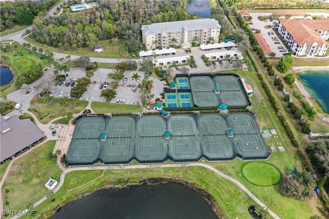 birds eye view of property with a water view