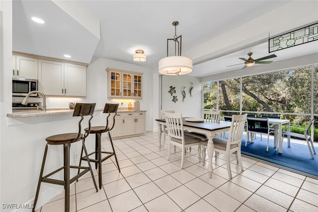 dining space featuring a healthy amount of sunlight, recessed lighting, a ceiling fan, and light tile patterned flooring