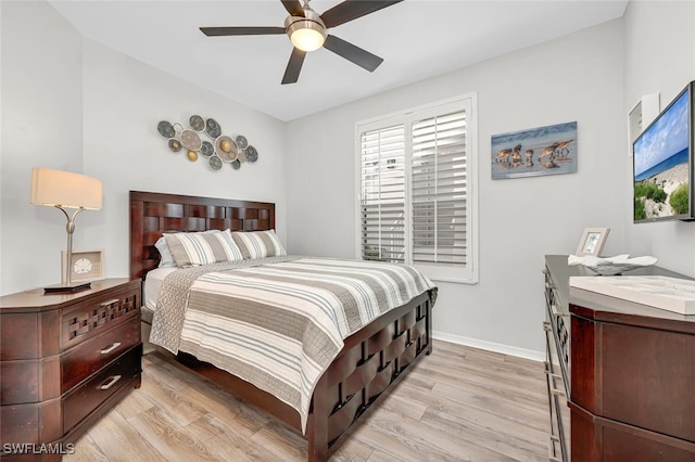 bedroom featuring light hardwood / wood-style floors and ceiling fan