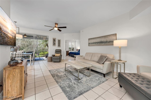 living room with light tile patterned floors and ceiling fan