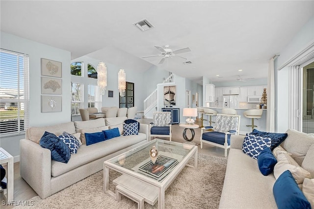 living room with lofted ceiling and ceiling fan