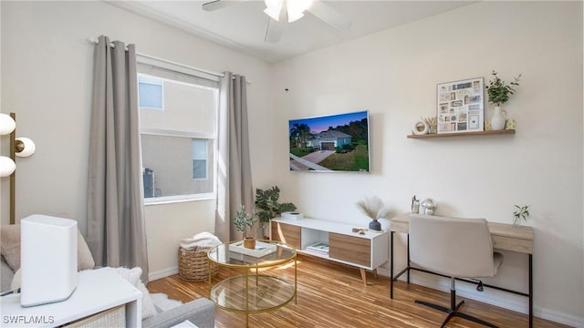 interior space with hardwood / wood-style floors and ceiling fan