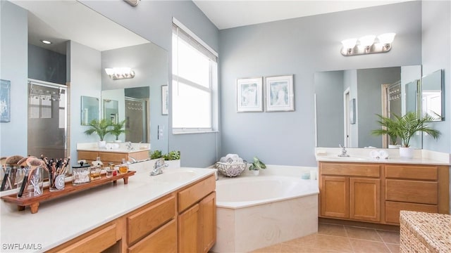 bathroom with vanity, independent shower and bath, and tile patterned flooring