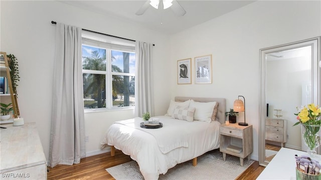 bedroom featuring wood-type flooring and ceiling fan