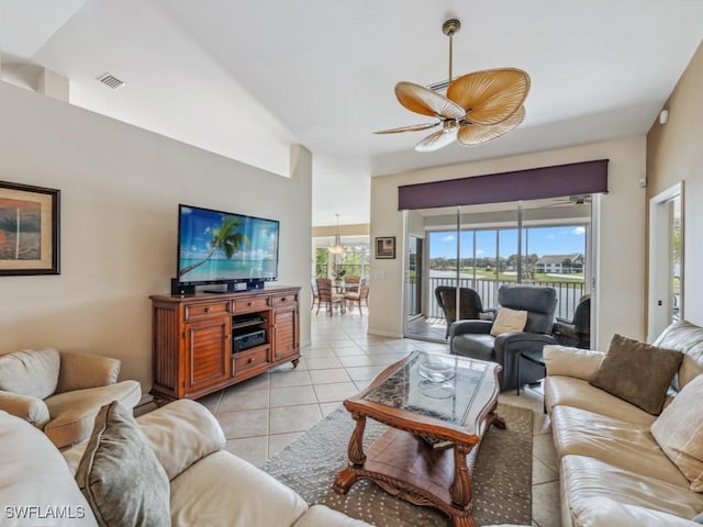 living room with light tile patterned floors, ceiling fan, and visible vents