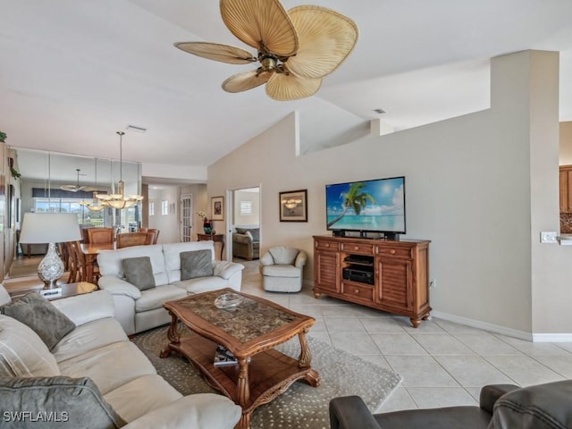 living area with ceiling fan with notable chandelier, lofted ceiling, baseboards, and light tile patterned floors