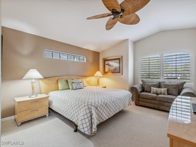 bedroom with vaulted ceiling, ceiling fan, baseboards, and light colored carpet