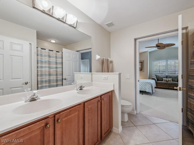 bathroom with tile patterned floors, visible vents, a sink, and ensuite bathroom