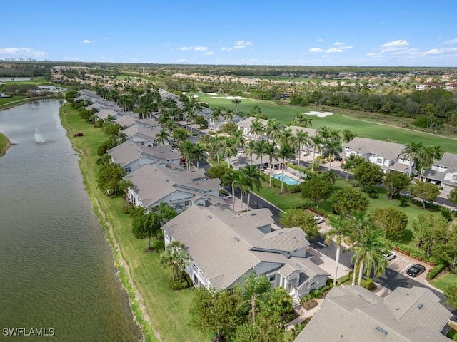 bird's eye view with a water view, view of golf course, and a residential view