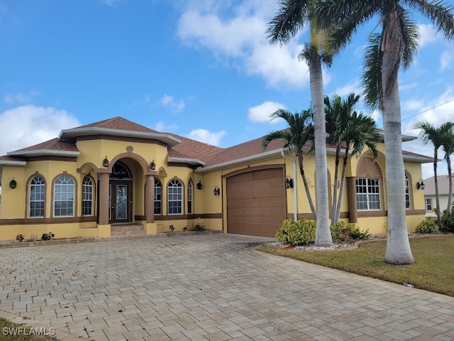 mediterranean / spanish-style house featuring a garage