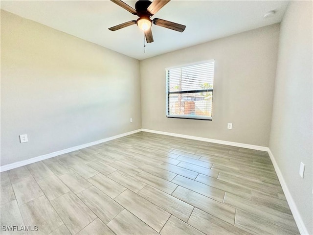 unfurnished room featuring light hardwood / wood-style floors and ceiling fan