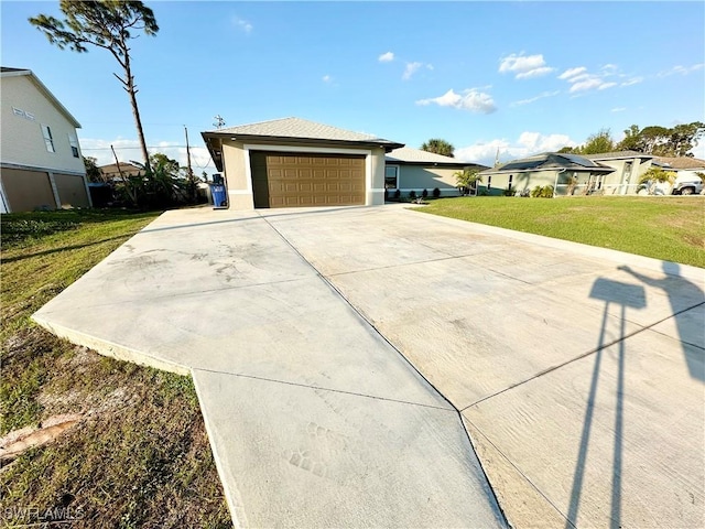 view of front of home featuring a garage and a front lawn