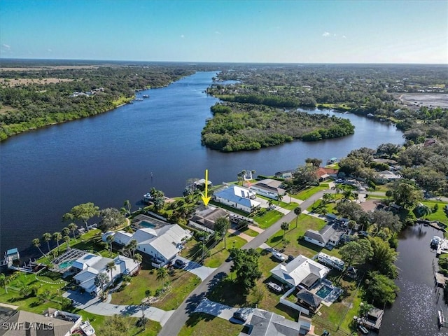 birds eye view of property featuring a water view