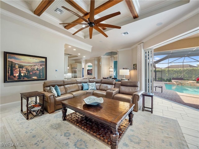 living room with beamed ceiling, ceiling fan, ornamental molding, and coffered ceiling