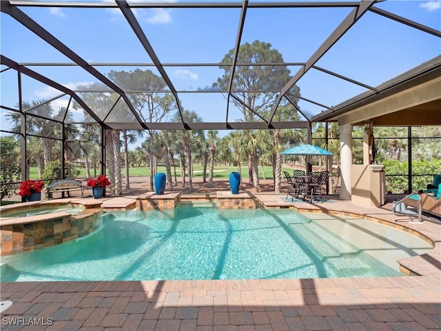 view of pool with a lanai, a patio, and an in ground hot tub