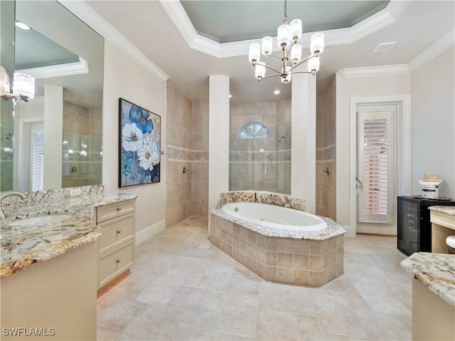 bathroom featuring a raised ceiling, ornamental molding, vanity, and plus walk in shower